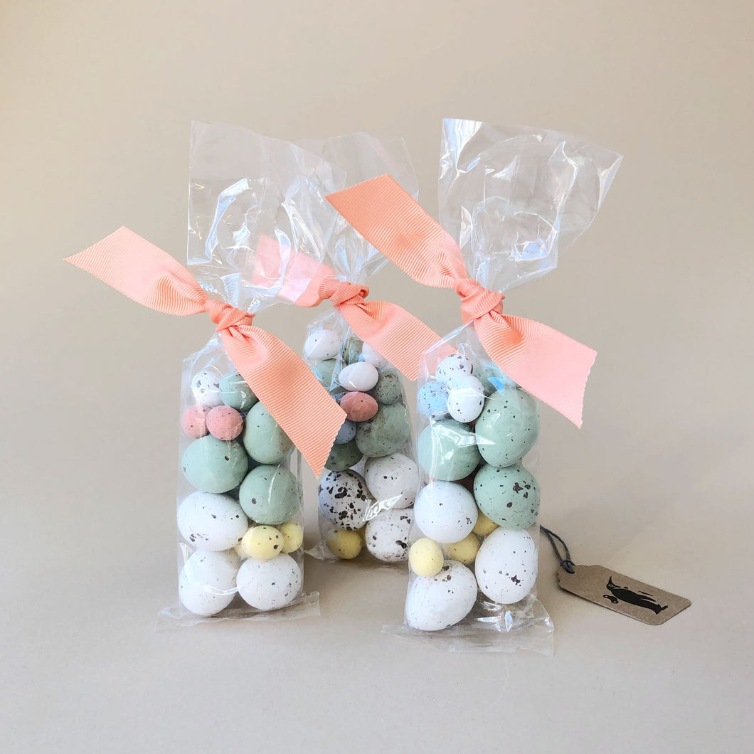 bag-of-speckled-hazelnut-truffle-eggs-tied-with-peach-ribbon