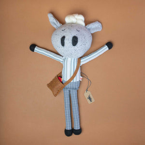 sheep-stuffie-in-blue-striped-shirt-and-grey-checked-pants-with-brown-bag-and-red-bird
