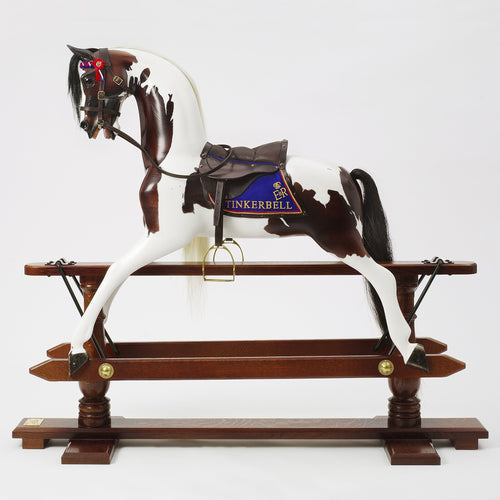 white-and-brown-rocking-horse-with-tingerbell-saddle-blanket-and-dark-tack