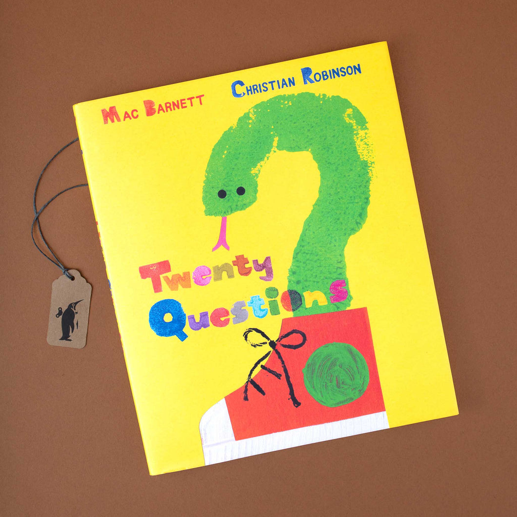yellow-book-cover-with-illustration-of-a-green-snake-coming-out-of-a-red-shoe-forming-a-question-mark