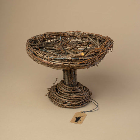 round-pedestal-made-from-small-brown-twigs