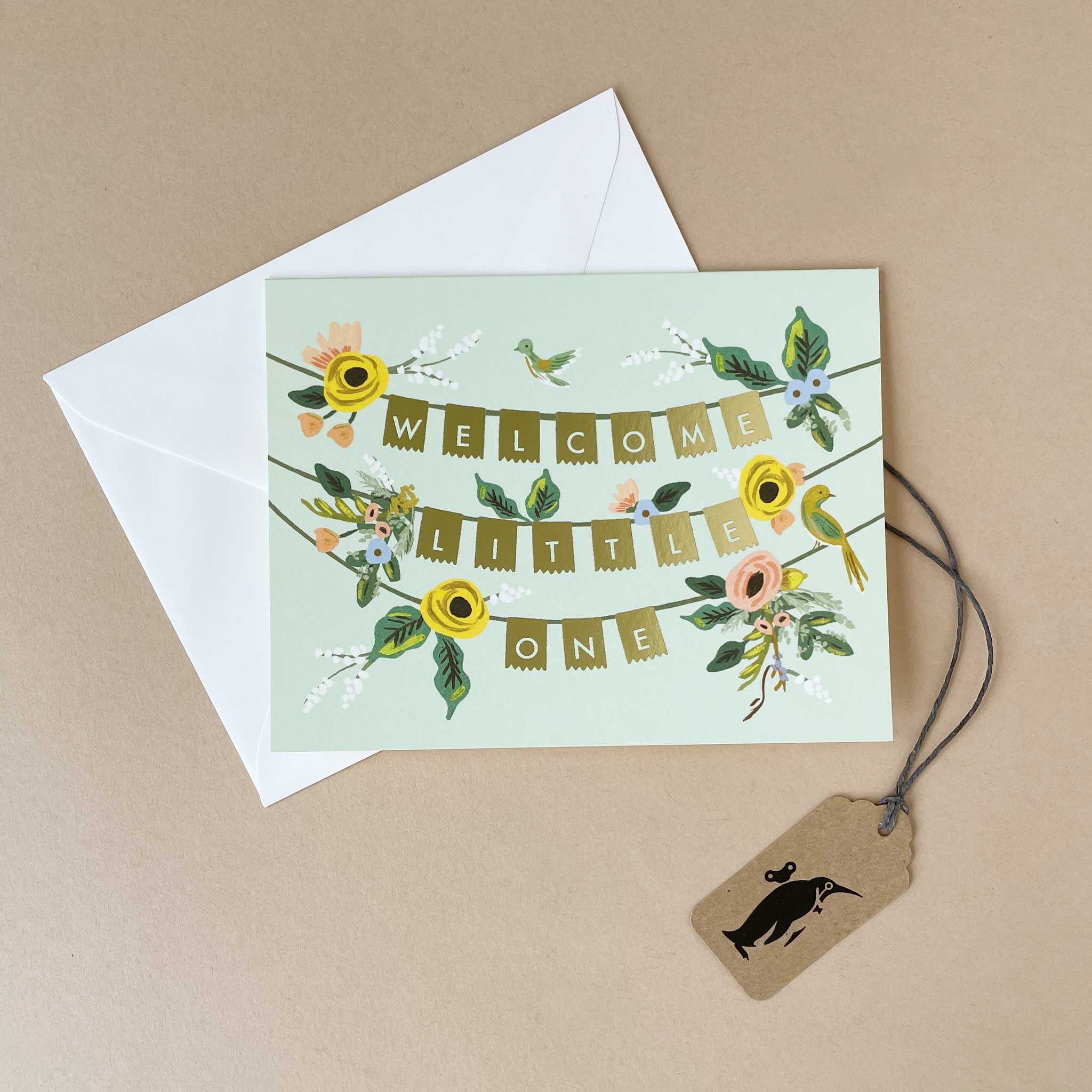 greeting-card-with-welcome-little-one-spelled-out-on-gold-garland-and-flowers