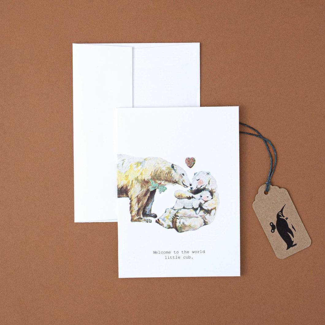 white-card-with-illustrated-bear-family-and-black-text-reading-welcome-to-the-world-little-cub