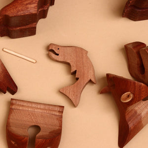 wooden-salmon-surrounded-by-scattered-pieces
