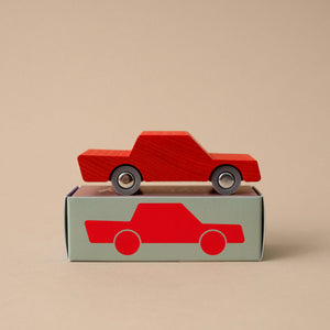 red-wooden-back-forth-car-on-top-of-box