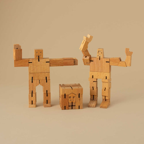 set-of-three-wooden-cubebot-in-different-poses