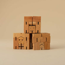 Load image into Gallery viewer, set-of-three-wooden-cubebots-in-cube-form-stacked