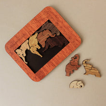 Load image into Gallery viewer, wooden-elephants-puzzle-in-orangish-wood-tone-frame