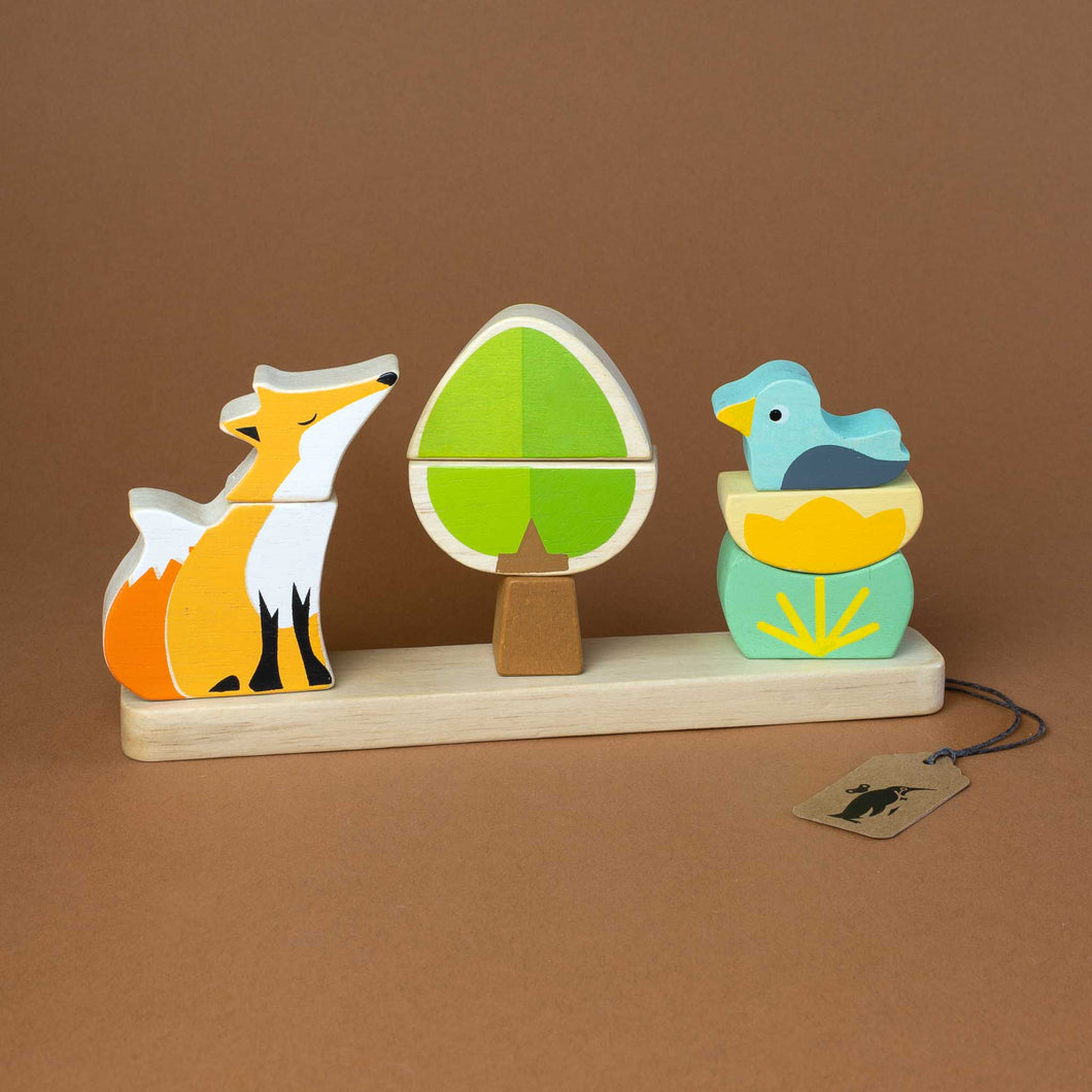 red-fox-and-a-blue-duck-on-a-shrub-and-a-three-piece-tree-on-a-wooden-base