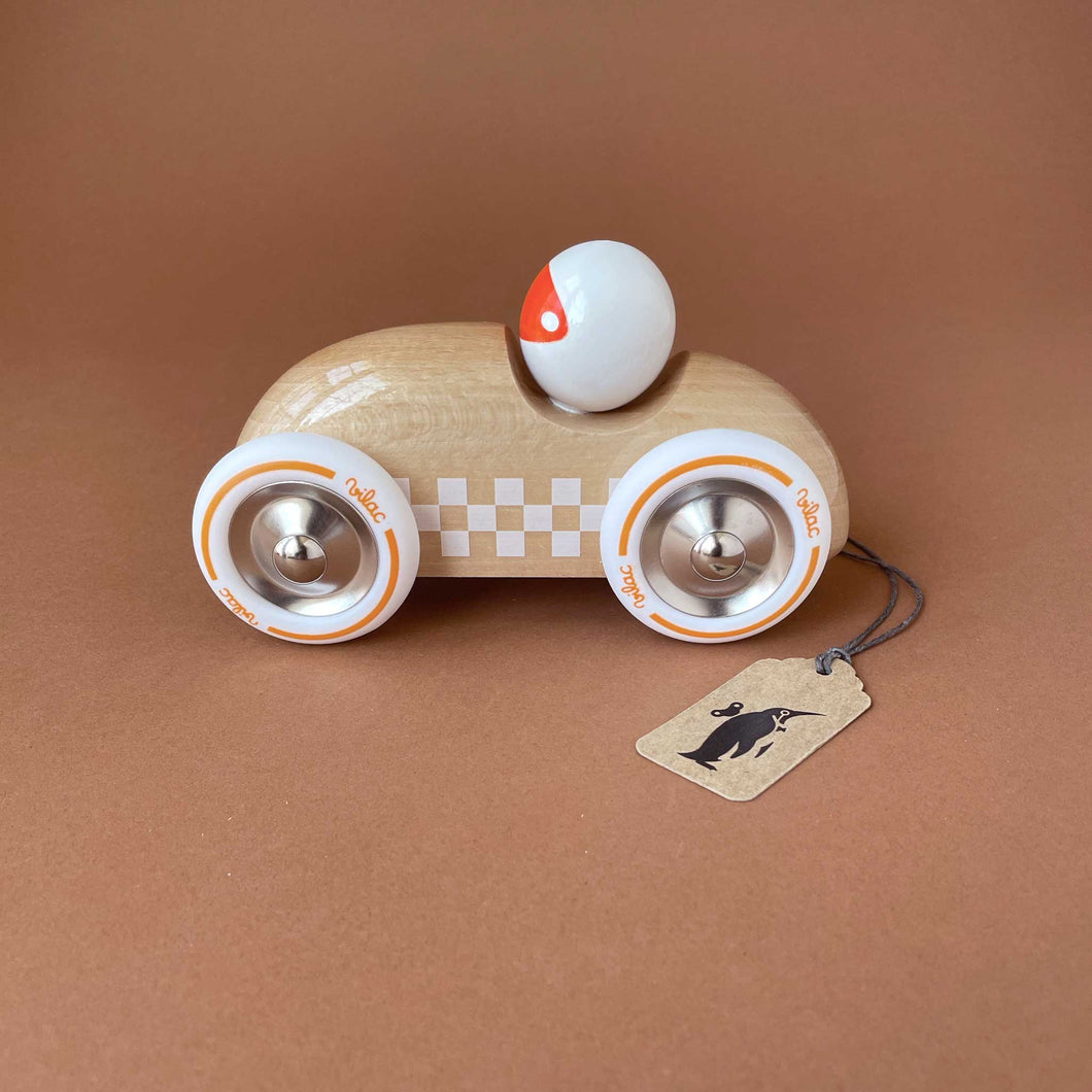 large-wooden-rally-car-natural-white-paint-and-integrated-driver-in-white-and-orange-helmet