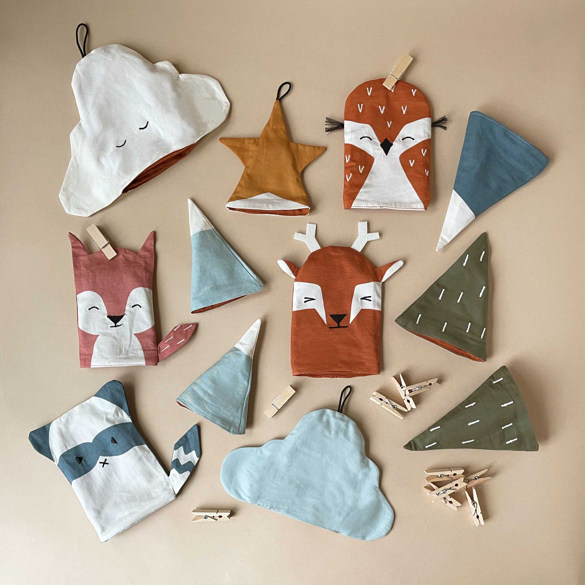 woodland-advent-calendar-woodland-animal-pockets-and-green-trees-and-mountains-with-clothespins-to-hang-up