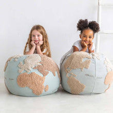 Load image into Gallery viewer, large-world-map-pouf-cushion-with-two-girls-leaning-on-them